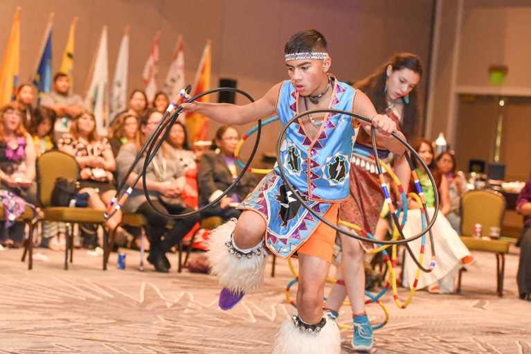 Native American teen boy doing traditional dance