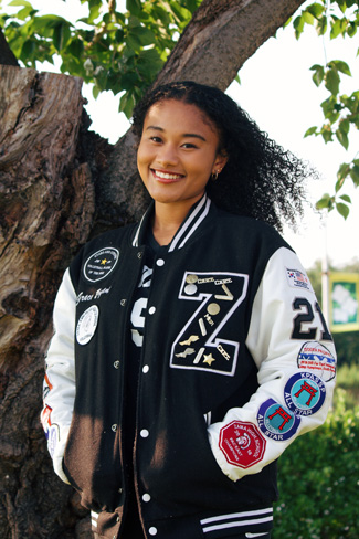 Grace in her Volleyball letterman jacket