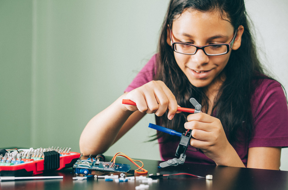 Teen girl working on STEM project